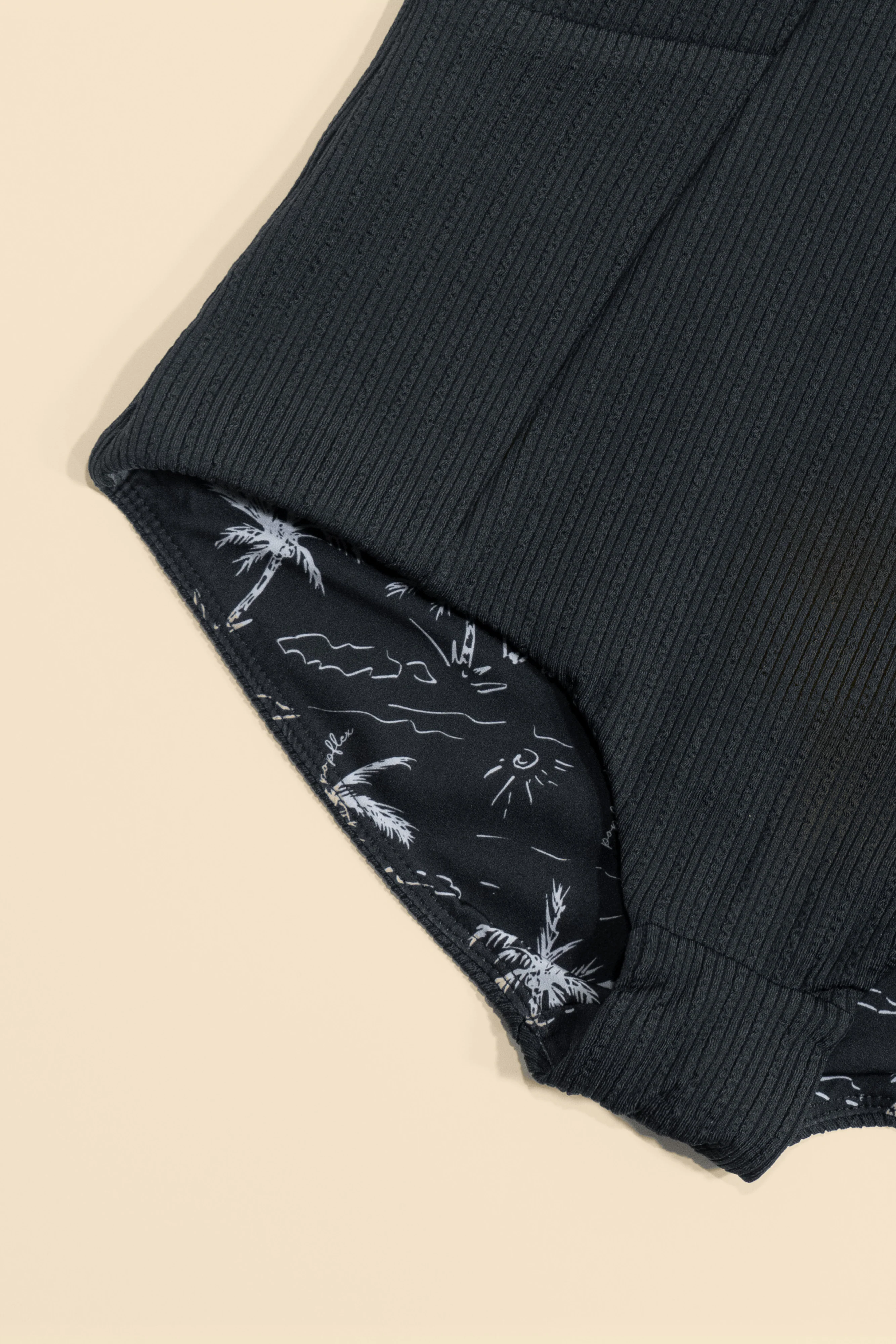 10440-reef-romper-with-pockets-black-1.webp